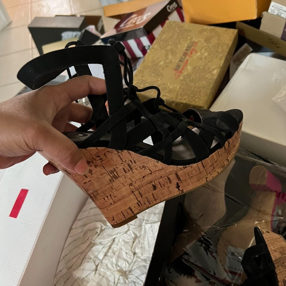 Brand new black guess wedge. Size 8